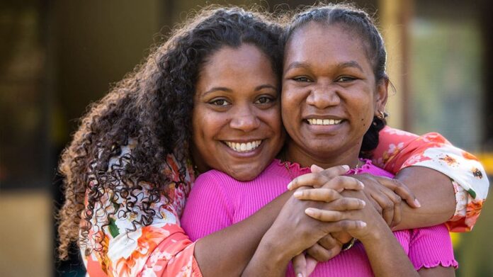 Two young aboriginal female students outdoors