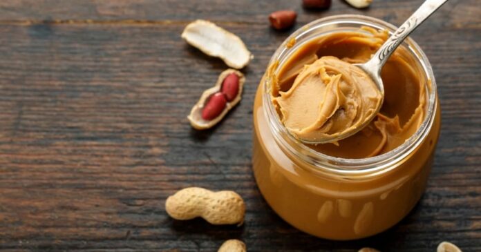 Jar of peanut butter on table