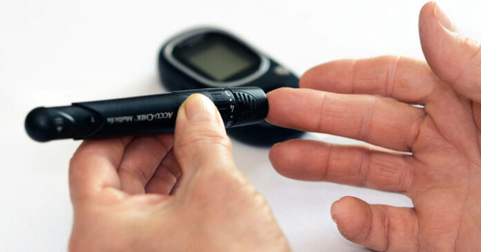 Hands testing blood sugar with a glucometer