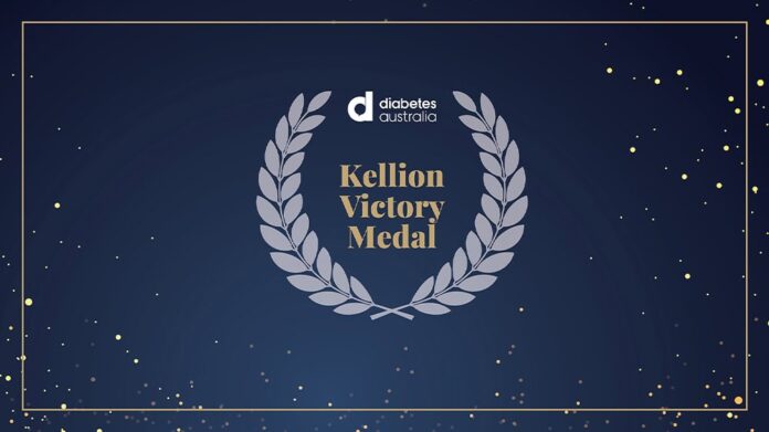 Sign of Kellion Victory Medal on a black background with stars and a grey laurel wreath
